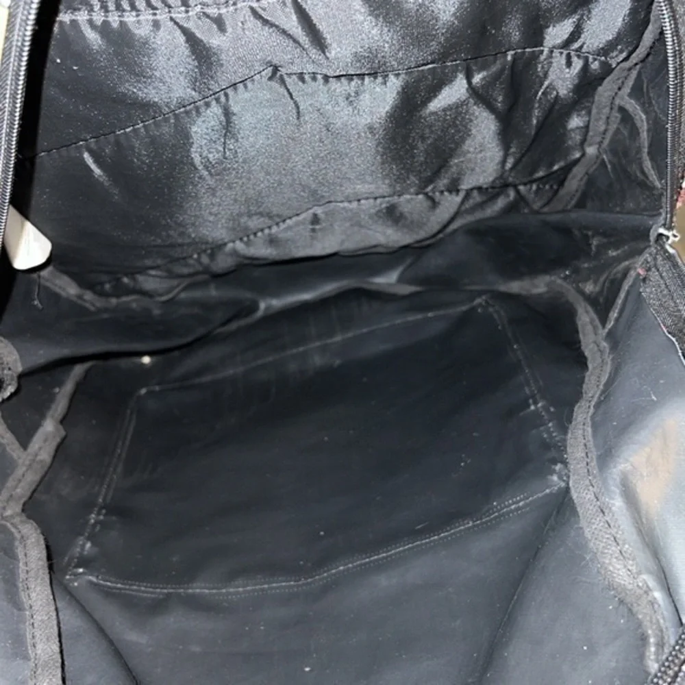 Marvel backpack. Some scuffs throughout but otherwise in good condition.